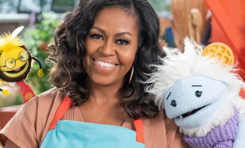 Michelle Obama with two puppets from "Waffles + Mochi."